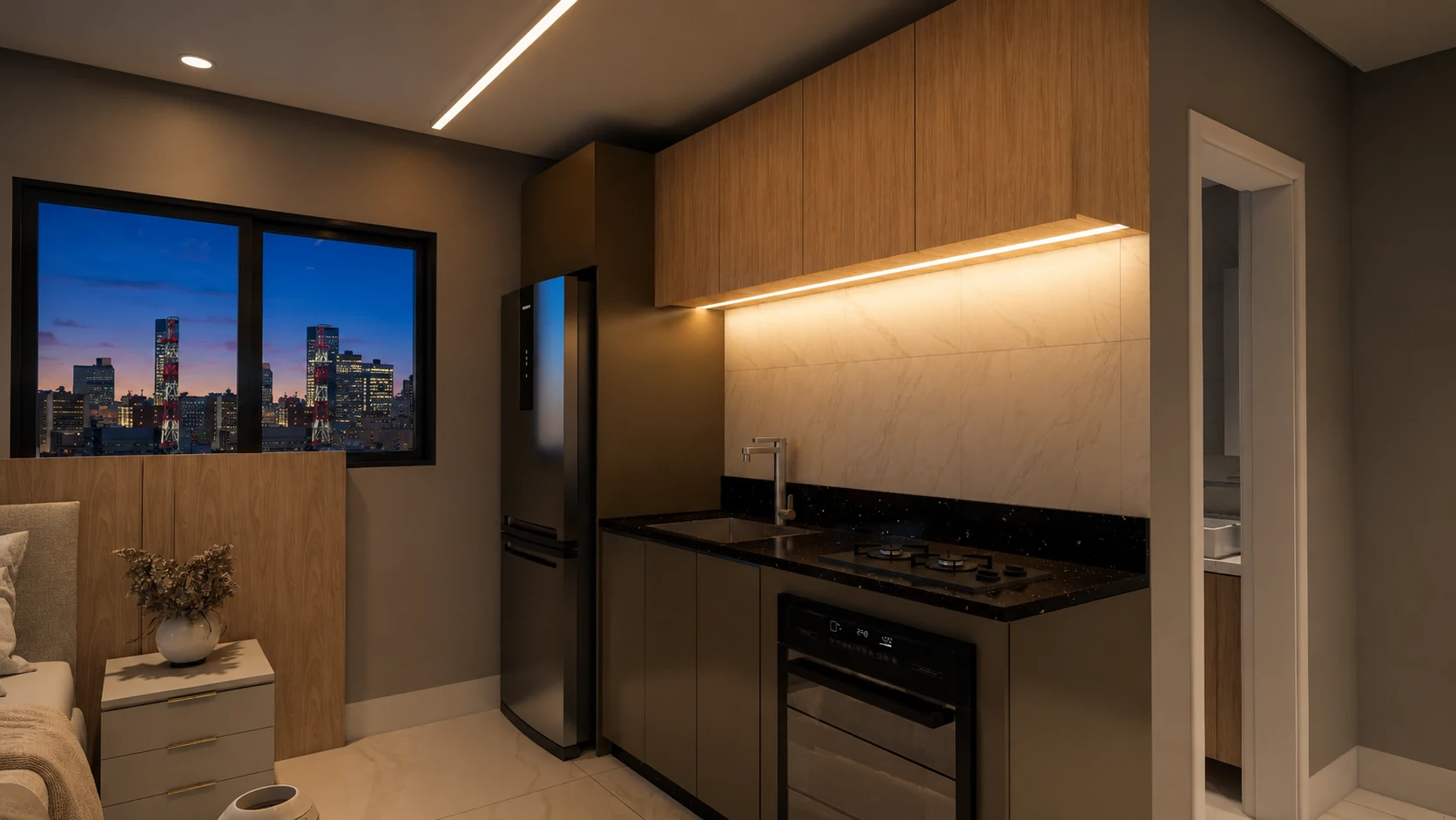 Cozinha integrada do studio com bancada, cooktop e marcenaria.